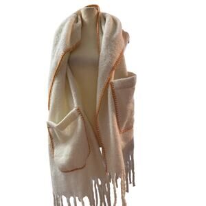 Brit and Company 
Cream colored scarf with pockets and orange trim